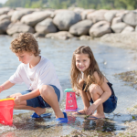 Children play on the beach at Friday Harbour